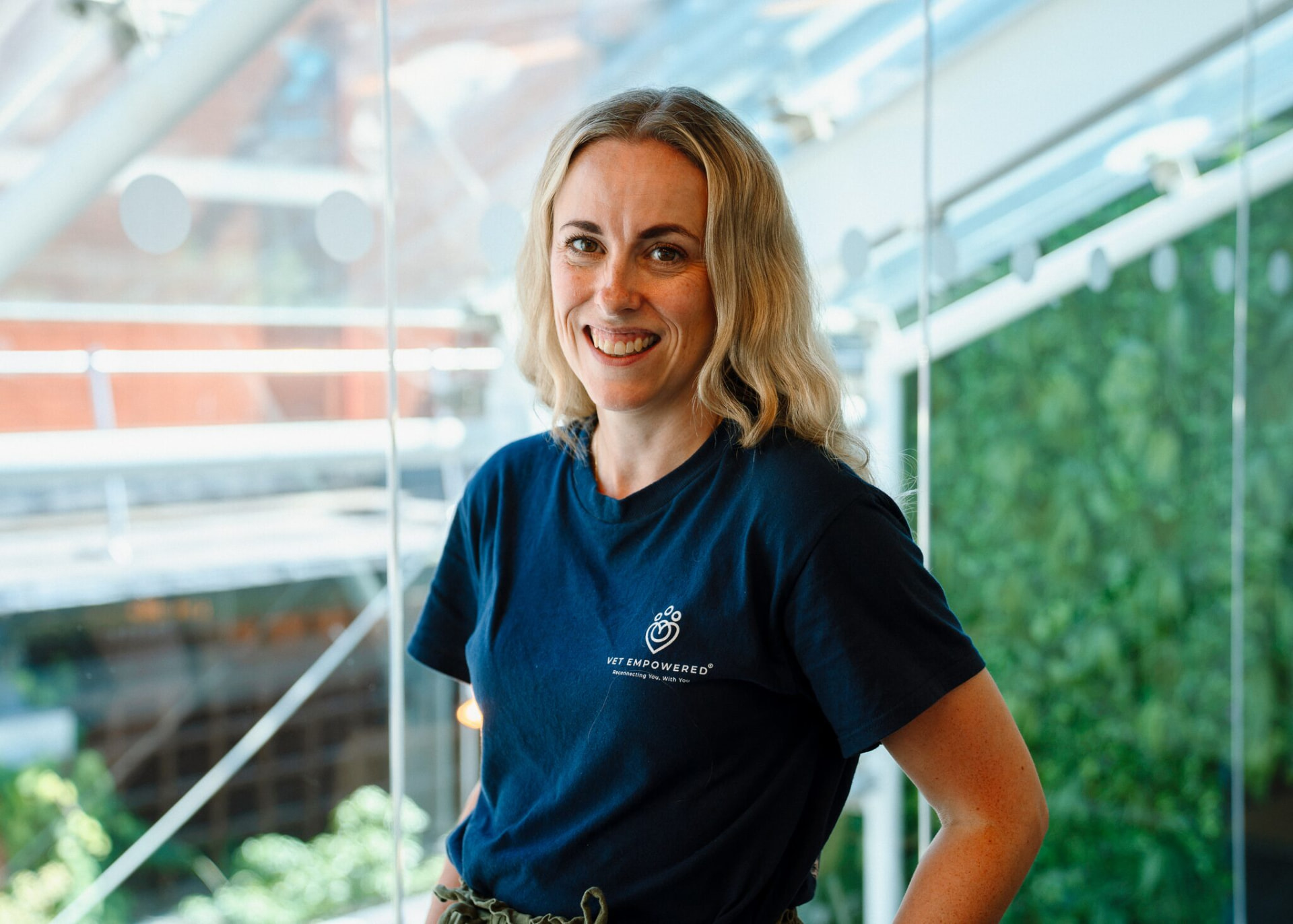 Claire Grigson in a Vet Empowered T-shirt, smiling