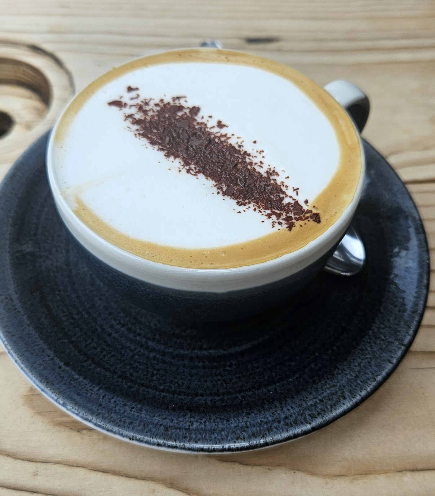 A cappuccino with chocolate sprinkled over the foam