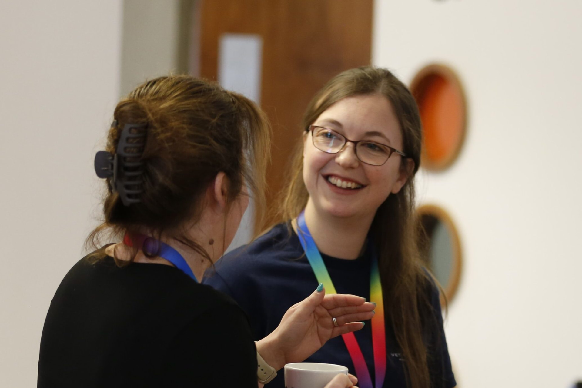 Beth Handley, one of our coaches, in a warm conversation at a Vet Empowered event