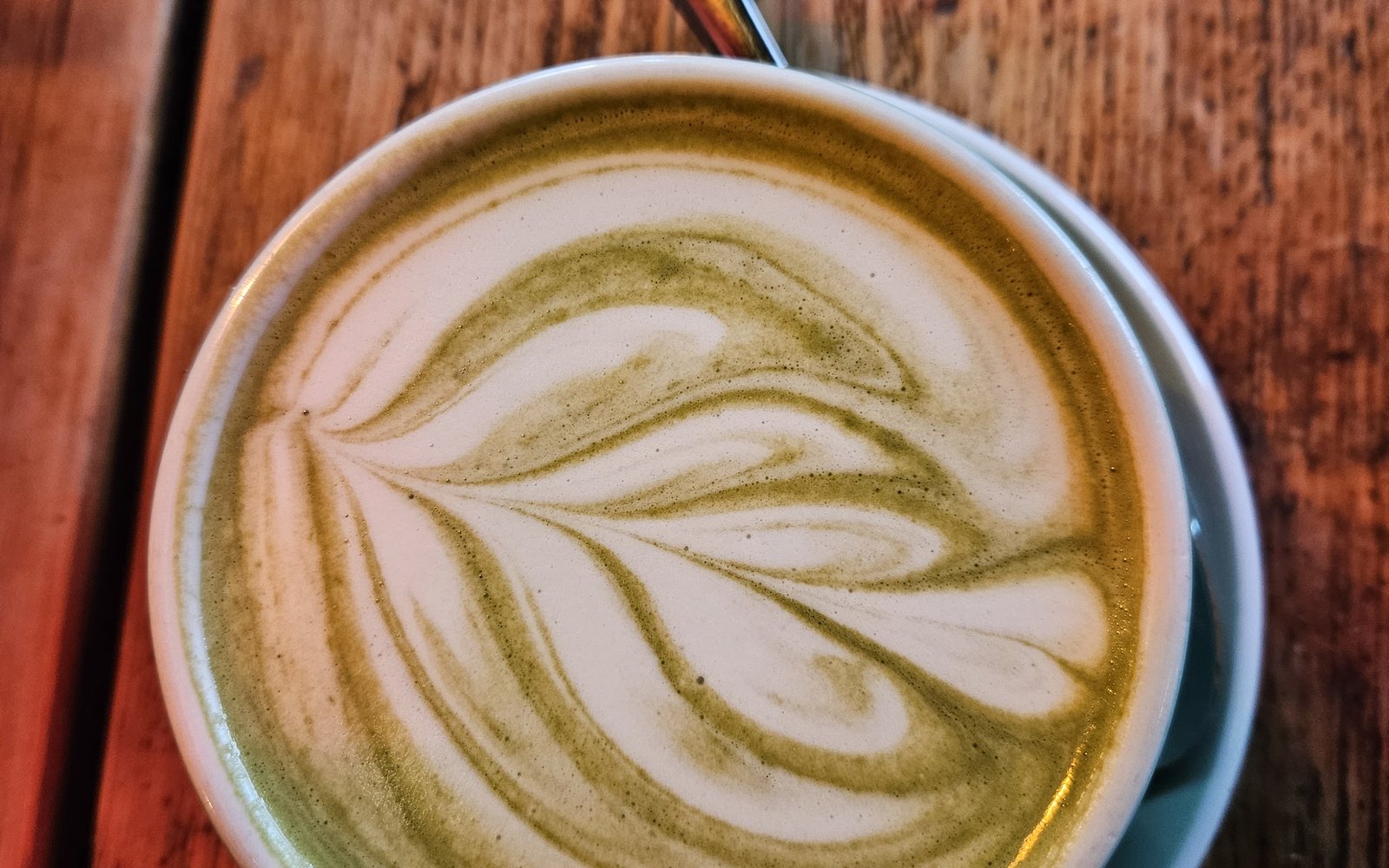 Latte art on a wooden table
